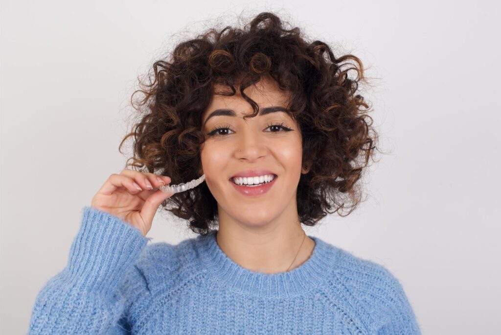 Young patient with her new Clear Aligners in Frisco treatment