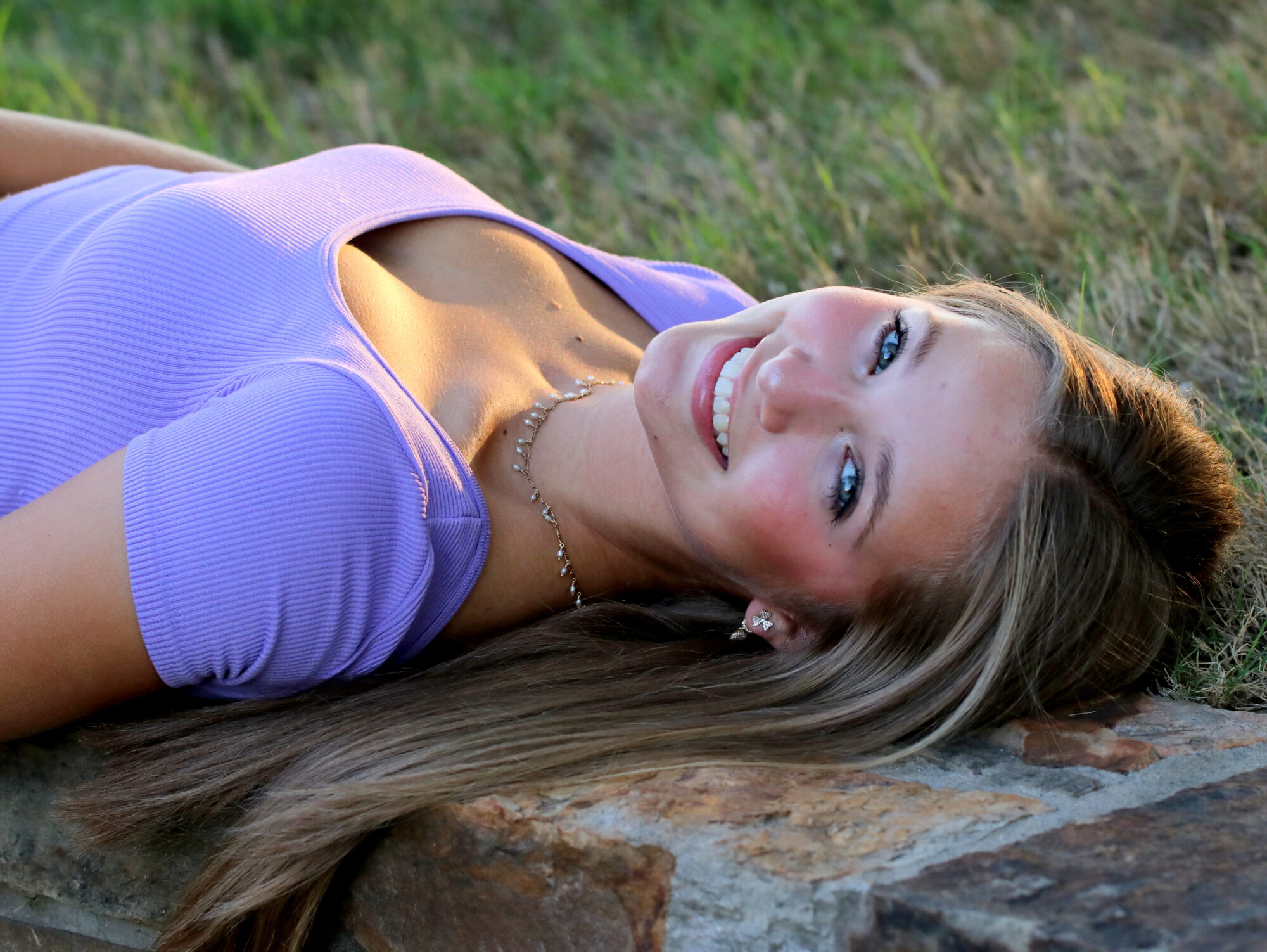 Young patient showing smile result after metal braces treatment in McKinney